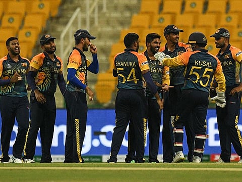 Sri Lanka's Wanindu Hasaranga de Silva (fourth right) celebrates with teammates after taking the wicket of Ireland's Gareth Delany during their ICC men’s Twenty20 World Cup qualifier at the Sheikh Zayed Stadium in Abu Dhabi on Wednesday.
