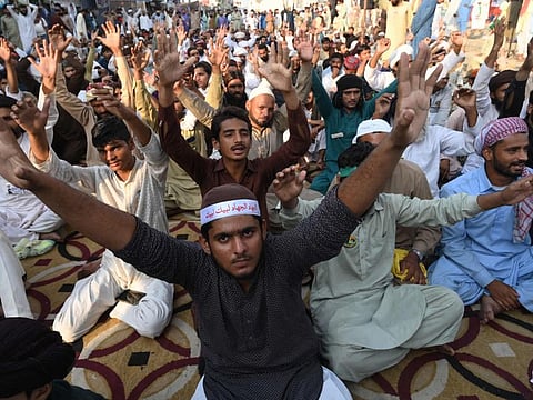 Supporters of Tehreek-e-Labbaik Pakistan (TLP) party shout slogans during a sit-in protest in Lahore on October 20, 2021, demanding the release of their leader Hafiz Saad Hussain Rizvi, son of late Khadim Hussain Rizvi, founder of hardline religious political party Tehreek-e-Labbaik.