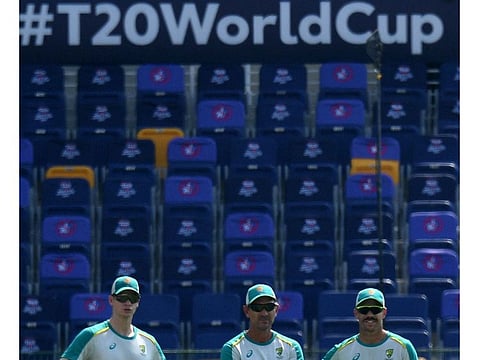 Core group: Australia's Steven Smith (left) coach Justin Langer and David Warner ahead of their Super-12 opener in Abu Dhabi last Saturday.
