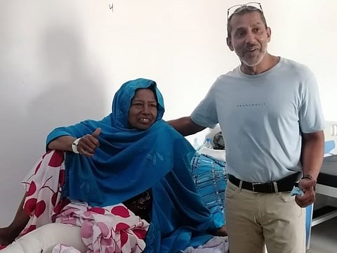 Dr Azam Badar Khan with a patient in Somaliland.