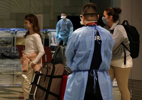 Passengers from Amsterdam arrive at Changi Airport under Singapore’s expanded Vaccinated Travel Lane (VTL) quarantine-free travel scheme, as the city-state opens its borders to more countries, in Singapore on October 20, 2021.