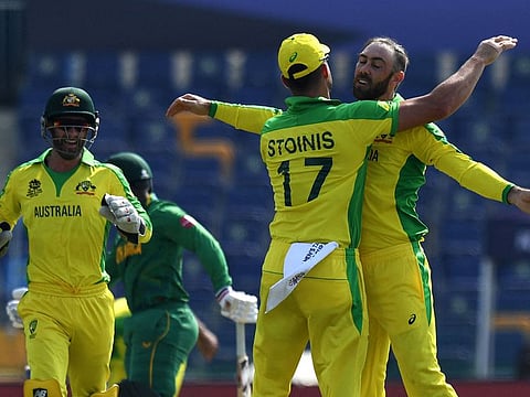 Australia's Glenn Maxwell (right) celebrates with teammate Marcus Stoinis after beating South Africa.