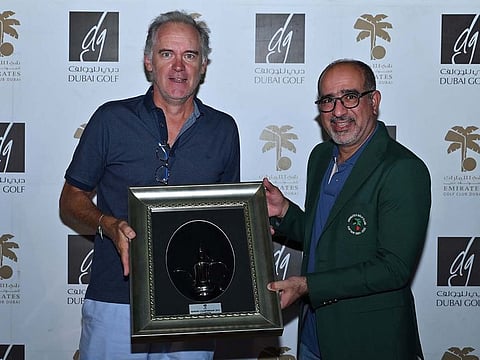David Waite receives his trophy from men's captain Abdulfattah Sharaf