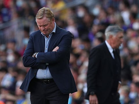 Barcelona coach Ronald Koeman was prevented from leaving the Nou Camp stadium by Barca fans after their team lost against Real Madrid.