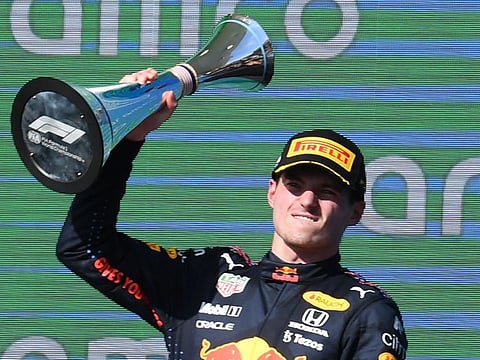 Red Bull's Dutch driver Max Verstappen celebrates on the podium winning the Formula One United States Grand Prix at the Circuit of The Americas in Austin, Texas.