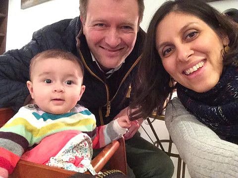 An undated handout image released by the Free Nazanin campaign in London on June 10, 2016 shows Nazanin Zaghari-Ratcliffe posing for a photograph with her husband Richard and daughter Gabriella.