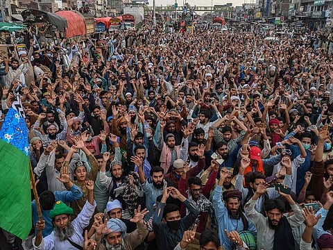 File image used for illustrative purposes: Supporters of Tehreek-e-Labbaik Pakistan (TLP) party gather in a protest march in Muridke, on October 24, 2021, during a march towards Islamabad demanding the release of their leader Hafiz Saad Hussain Rizvi, son of late Khadim Hussain Rizvi, founder of hardline religious political party Tehreek-e-Labbaik.