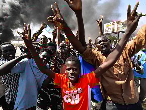 Sudanese people protest against a military coup that overthrew the transition to civilian rule, on October 25, 2021 in the capital Khartoum's twin city of Omdurman.