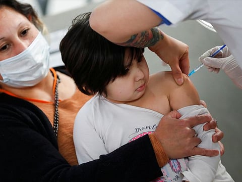 Jade Velozo, 4, receives a dose of the Sinopharm vaccine against COVID-19 at a vaccination centre in Buenos Aires. Bahrain has approved the Sinopharm COVID-19 vaccine for children aged between 3 and 11 years from October 27,