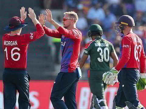 Always in control: England players celebrate the fall of a wicket against Bangladesh in Abu Dhabi on Wednesday.