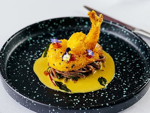 Punjab Grill's ragi (finger millet) noodles teamed with a coconut broth and sesame-crusted shrimp