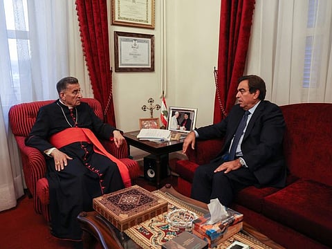 Lebanon's Information Minister Georges Kordahi meets with Cardinal Bechara Al Rai at the Maronite Patriarchate in the mountain village of Bkerki, northeast of the capital, on October 30, 2021.