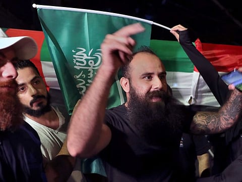 Lebanese chant slogans in support of Saudi Arabia against comments made by a Lebanese minister over the war in Yemen, in front of the Saudi Arabia Embassy in Beirut, on October 30, 2021.