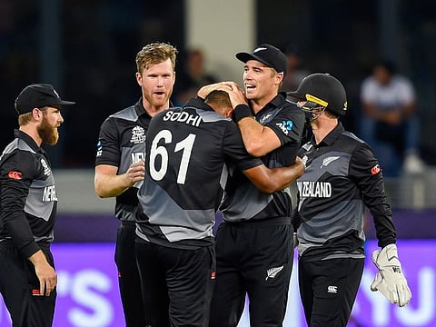 New Zealand's Ish Sodhi celebrates with his teammates after taking the wicket of Indian captain Virat Kohli during their Super-12 T20 World Cup match at the Dubai International Cricket Stadium, in Dubai.