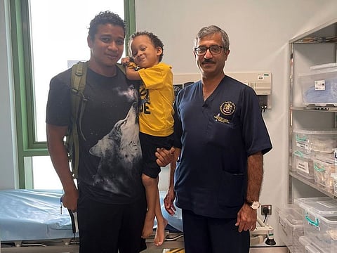 Four-year-old Dimitry Horeau from the Seychelles with his father Gino and paediatric surgeon Dr Nadeem Haider.
