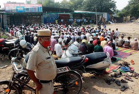 The faithful perform namaz in the open site amid police presence, at Sector 12 area, in Gurugram on October 29, 2021.