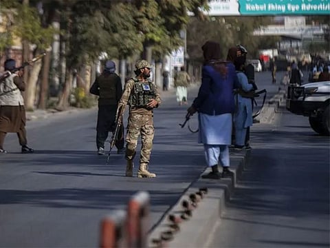 Taliban fighters block roads after an explosion Tuesday, November 2, 2021.