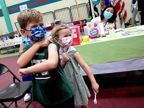 Wren Nagata, 7, with his sister 5-year-old Mallory Nagata, of Pasadena, show off their bandaids after receiving their COVID-19 vaccines during an event kicking off coronavirus vaccinations for children age 5-11 at Eugene A. Obregon Park in Los Angeles on Wednesday, Nov. 3, 2021.