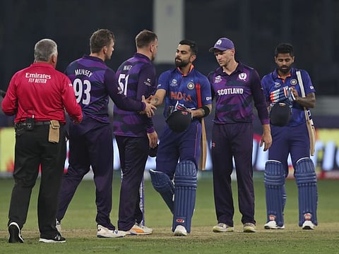 India's captain Virat Kohli greets Scotland's players after India won the Cricket Twenty20 World Cup match in Dubai, UAE.