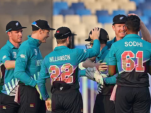 New Zealand celebrate after beating Namibia by 52 runs in the ICC men’s Twenty20 World Cup cricket match at the Sharjah Cricket Stadium in Sharjah, UAE.