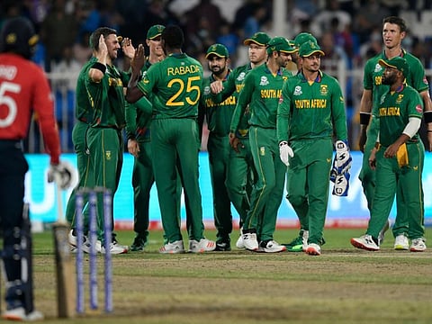South African players celebrate after the dismissal of England's Chris Jordan (not pictured) during the ICC mens Twenty20 World Cup cricket match at the Sharjah Cricket Stadium in Sharjah. They won the match but failed to qualify for the semifinals.