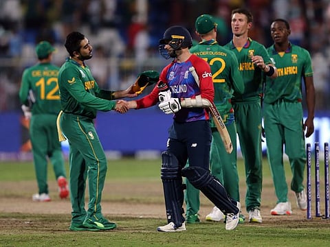 South Africa's Tabraiz Shamsi shakes hands with England's Mark Wood at the end of play.