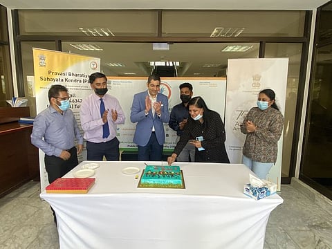 Consul General of India in Dubai Dr Aman Puri and others at the cake cutting ceremony to mark the first anniversary of the Pravasi Bharatiya Sahayata Kendra.