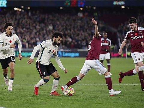 Liverpool's Mohamed Salah in action with West Ham United's Aaron Cresswell.