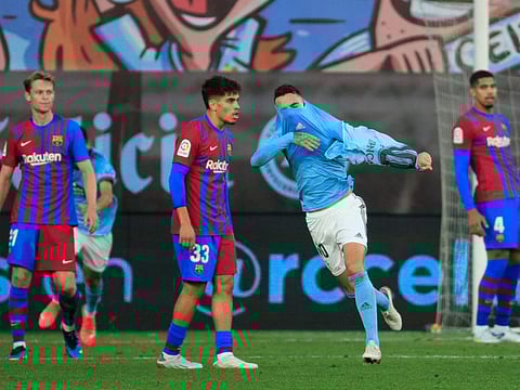 Celta Vigo's Iago Aspas celebrates after scoring his side's third goal during a Spanish La Liga match between Celta and Barcelona at the Balaidos stadium in Vigo, Spain.