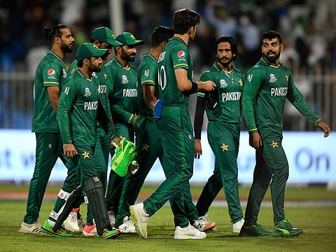 Pakistan team walk back after making it five wins out of five in their Super-12 matches at Sharjah Stadium.