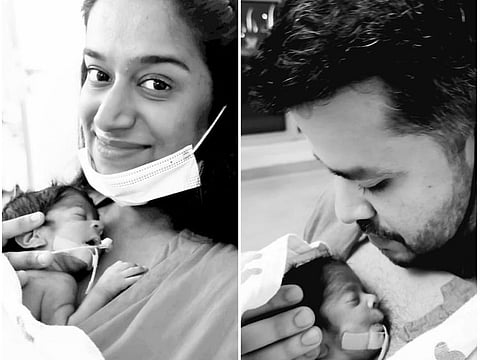 Jane Ferns and her husband with their twins in newborn intensive care unit.