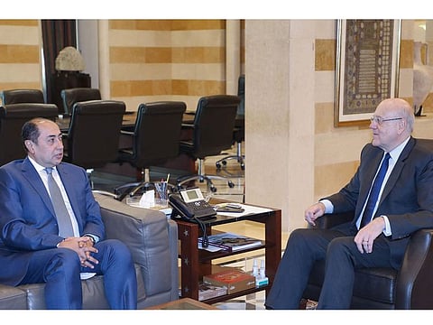 Arab League's assistant secretary general Hossam Zaki (left) with Lebanese Prime Minister Najib Mikati.