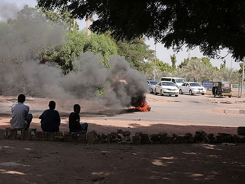People burn tyres in Khartoum, Sudan, Sunday, Nov. 7, 2021.