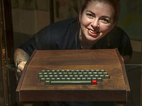 Morgana Blackwelder poses with a hand-built Apple-1 displayed for auction at John Moran Auctioneers on Saturday, Nov. 6, 2021 in Monrovia, California.