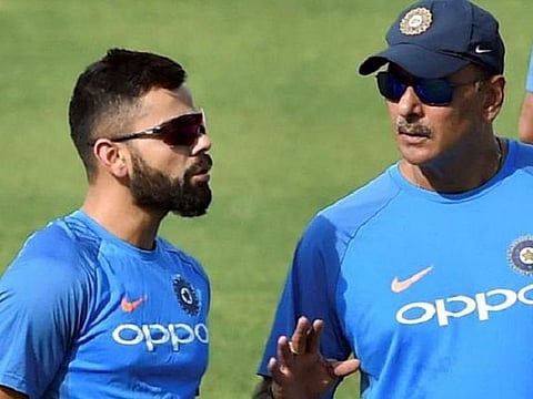 Virat Kohli (left) and Ravi Shastri: An enduring partnership ends in Indian cricket.