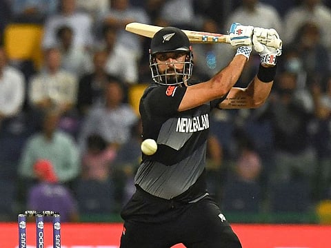 New Zealand’s Daryl Mitchell plays a shot during the ICC Men’s Twenty20 World Cup semifinal against England at the Zayed Cricket Stadium in Abu Dhabi on November 10, 2021.