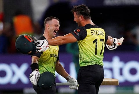 Australia's Matthew Wade (left) and Marcus Stoinis celebrate after beating Pakistan in a thrilling T20 World Cup semifinal at the Dubai International Cricket Stadium, Dubai, UAE.