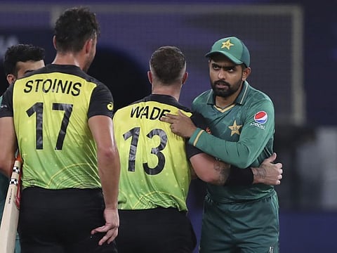 Pakistan's captain Babar Azam (right) congratulates Australia's Matthew Wade on their win during the Cricket Twenty20 World Cup second semi-final match in Dubai, UAE.