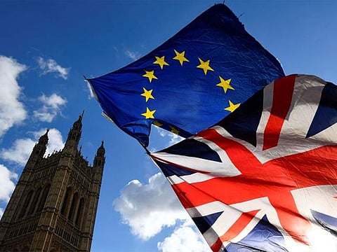 British and EU flags flutter outside the Houses of Parliament in London, Britain