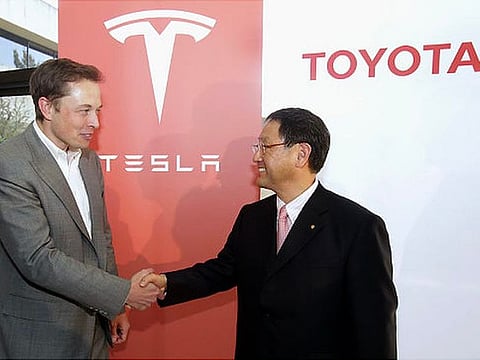 MUTUAL ADMIRATION? In March, South Korean media reported that Toyota would use Tesla technology to reduce R&D for its vehicles' electronic operating and self-driving system; in turn Tesla could make use of Toyota's manufacturing efficiency for producing affordable, sub-$25,000 EVs. A Toyota spokesperson dismissed the report as "speculation". | File photo shows Tesla CEO Elon Musk and Toyota President Akio Toyoda shaking hands in 2010 during the announcement of their joint RAV4 EV project at the Tesla Motors headquarters Palo Alto, California.