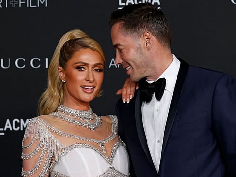 US media personality Paris Hilton and Carter Reum arrive for the 10th annual LACMA Art+Film gala at the Los Angeles County Museum of Art (LACMA) in Los Angeles, California on November 6, 2021.