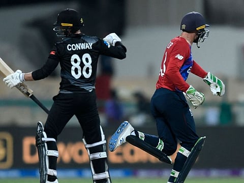 New Zealand's Devon Conway (left) will miss Sunday's showpiece against Australia at the T20 World Cup after breaking his hand punching his own bat.