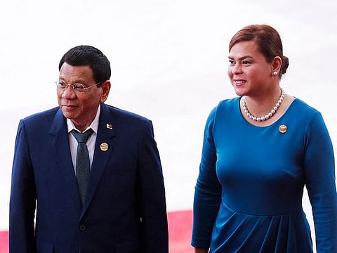 In this file photo taken on April 10, 2018, Philippine President Rodrigo Duterte (L) and his daughter Sara arrive for the opening of the Boao Forum for Asia (BFA) Annual Conference 2018 in Boao, south China's Hainan province.