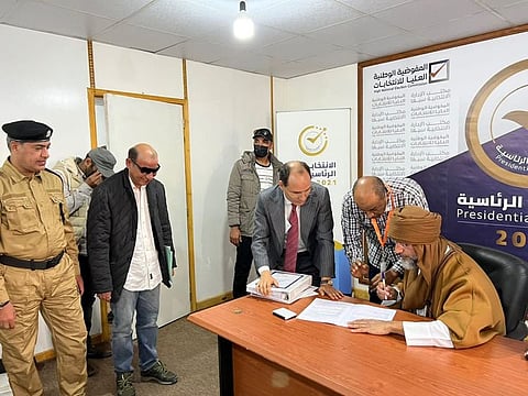 Saif Al Islam Gaddafi, son of Libya's former leader Muammar Gaddafi, registers as a presidential candidate for the December 24 election, at the registration centre in the southern town of Sebha, on November 14, 2020.