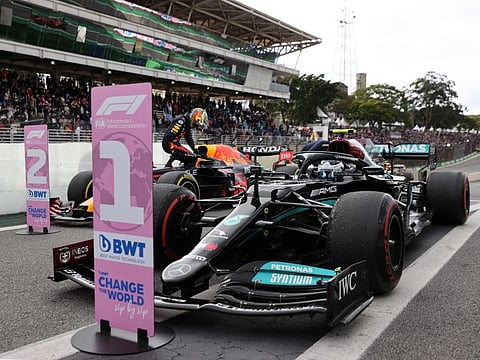 Mercedes' Finnish driver Valtteri Bottas sits inside his car after winning the pole position in the sprint qualifying at the Autodromo Jose Carlos Pace, or Interlagos racetrack, in Sao Paulo ahead of Brazil's Formula One Sao Paulo Grand Prix.
