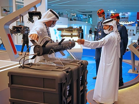 People visit the Halcon stall, a regional leader in the end-to-end manufacturing of precision-guided systems, at the Dubai Airshow 2021 at Dubai World Central in Dubai, on Sunday November 14, 2021. Photo Clint Egbert/Gulf News