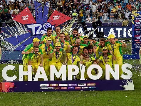 Australian players celebrate with the trophy after winning the final of the ICC T20 World Cup in Dubai on Sunday.