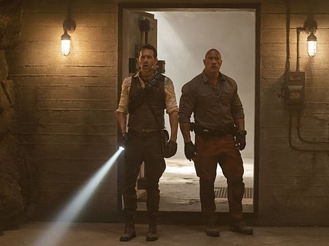 Red Notice. (L to R) Ryan Reynolds as Nolan Booth and Dwayne Johnson as John Hartley in Red Notice.