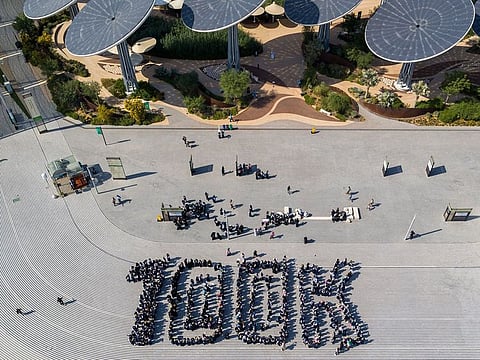 Students formed '100K' at Expo 2020 Dubai on Wednesday to celebrate the milestone of 100,000 public school pupils having visited Expo since its opening on October 1