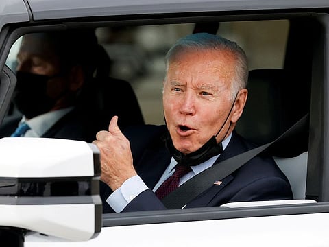 U.S. President Joe Biden gestures after driving a Hummer EV